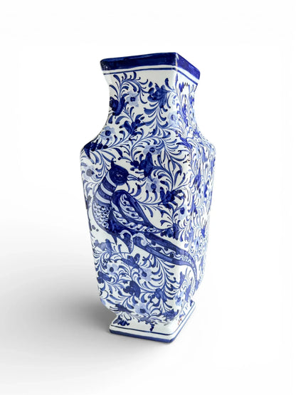 Blue and white porcelain vase with intricate floral and bird patterns, vintage home decor