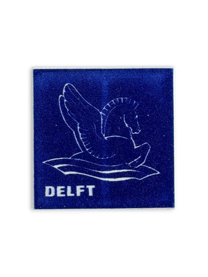 Close-up detail of a Regina Delft tile showing the protective felt-lined backing, designed to protect surfaces when used as a decorative coaster.