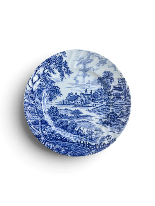Ridgway Meadowsweet blue and white ironstone dessert plate, 17.6 cm, showing an English village scene with cottages, church tower and trees on a scalloped rim.
