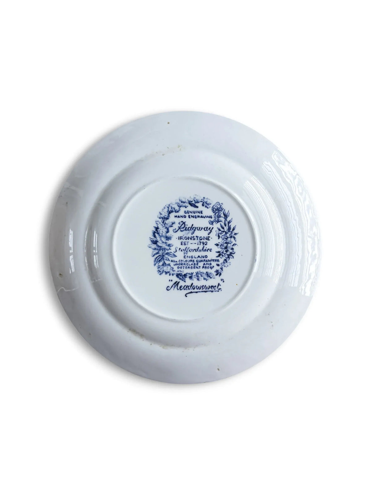 Reverse of the Ridgway Meadowsweet ironstone plate with the Staffordshire floral-wreath backstamp reading Genuine Hand Engraving, Est 1792, and Meadowsweet.