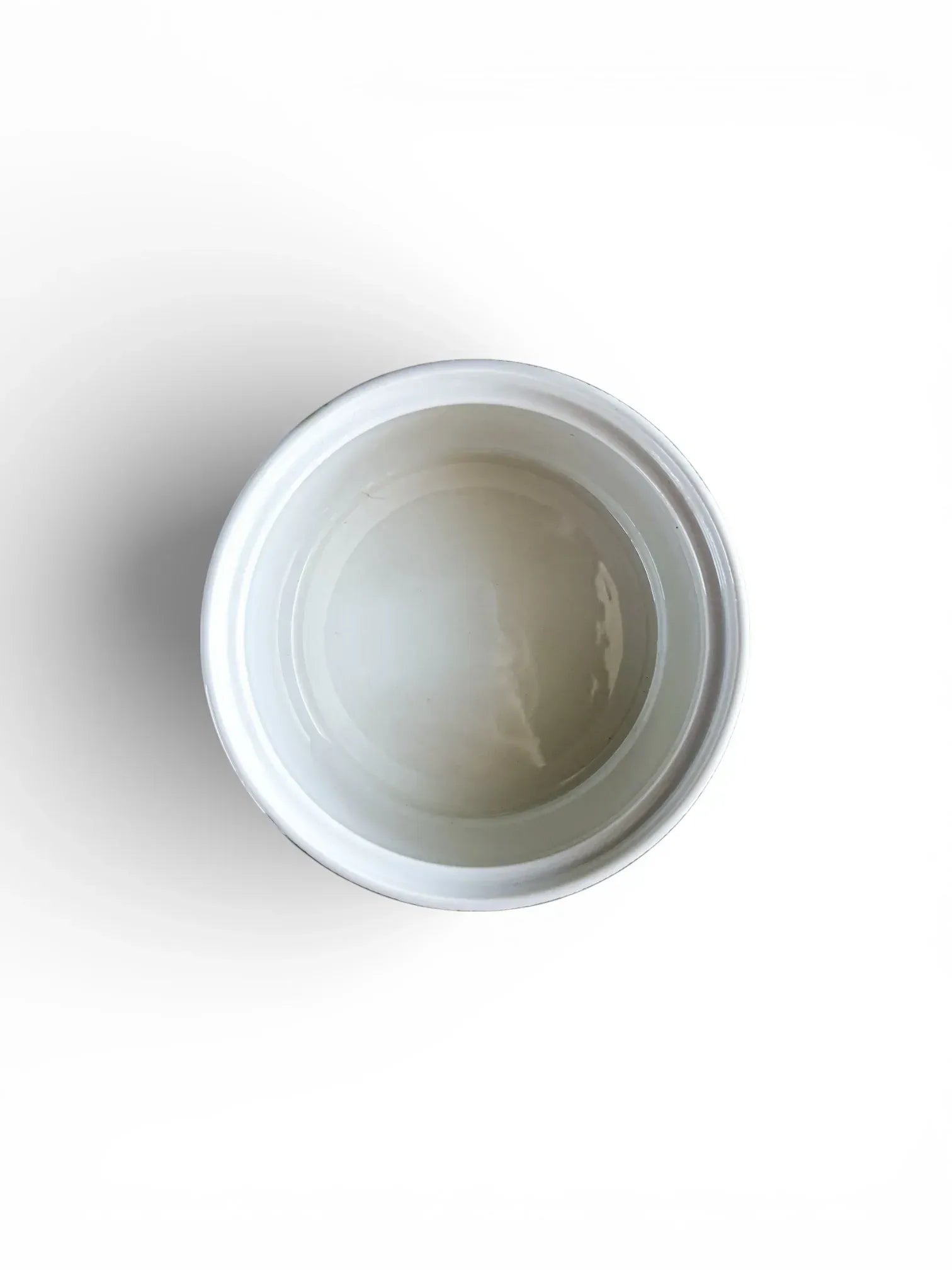 A top-down view into the empty Rörstrand Grön Anna sugar bowl, showing a clean, white, glazed interior free of crazing or staining.