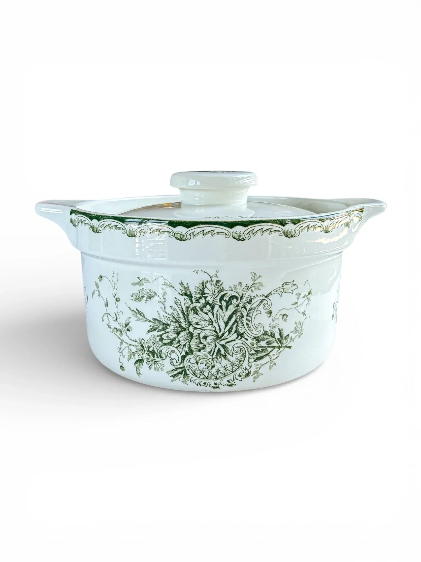A side-view studio shot of the 22.4 cm Rörstrand Grön Anna rectangular lidded tureen, showing the forest green floral pattern and integrated handles on a white flintware body.