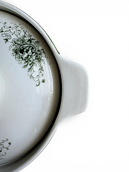 Detailed view of vintage crazing patterns on the integrated handle of a Rörstrand vegetable server.