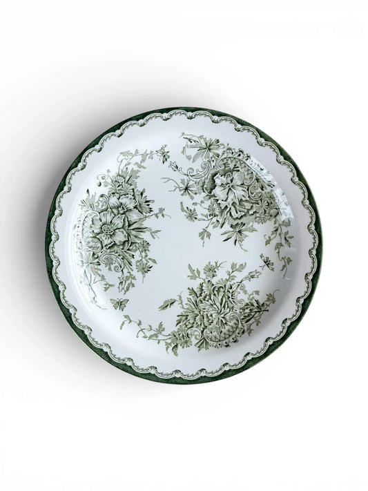 Top-down view of a 21 cm Rörstrand Grön Anna salad plate, showcasing the forest green floral motif and scalloped edge on white flintware.