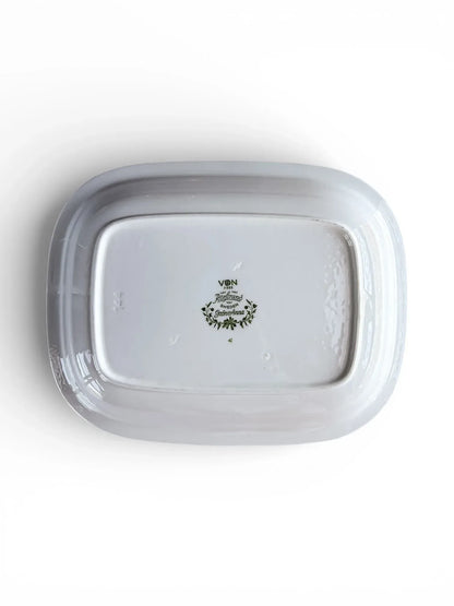 The underside of the Rörstrand Grön Anna dish showing the green "Made in Sweden" backstamp and VDN F555 durability code.