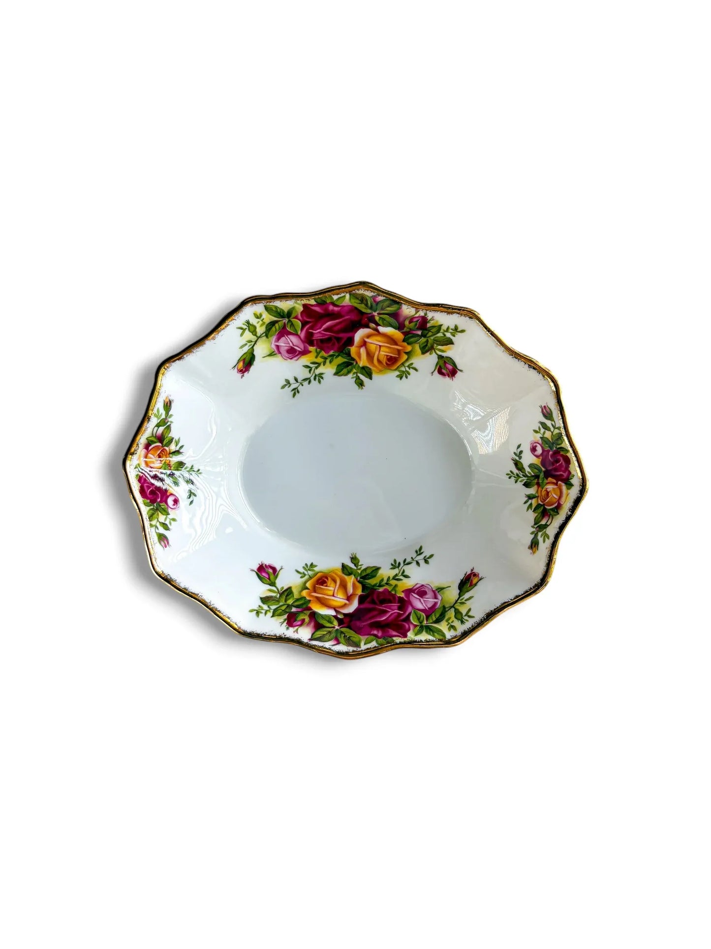 A top-down view of an oval Royal Albert Old Country Roses bonbon dish on a white background. The fine bone china dish features vibrant clusters of pink, yellow, and deep red roses with a scalloped, gold-trimmed edge.