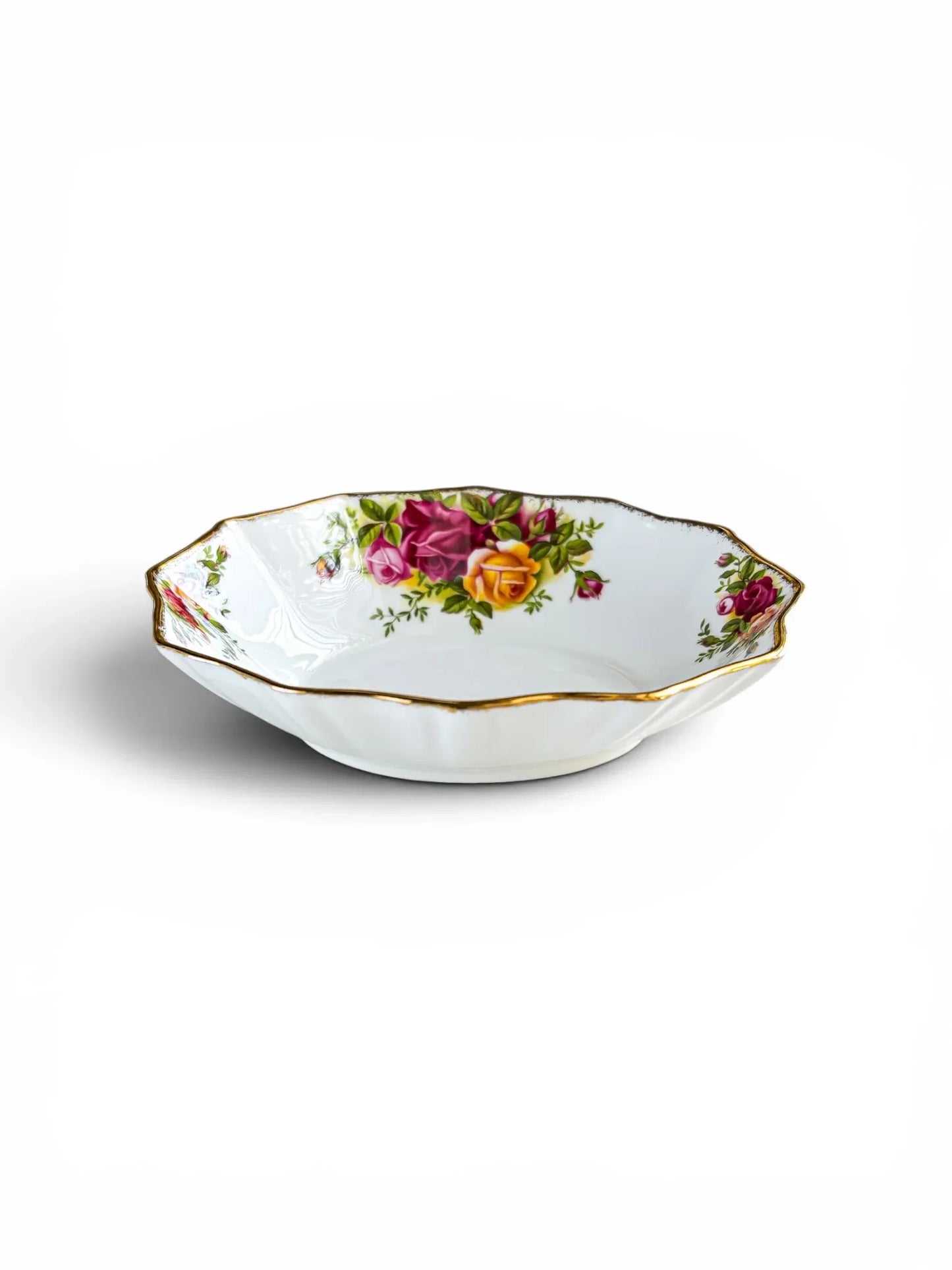 A side-angle view of a shallow Royal Albert Old Country Roses sweet meat dish, showing its fluted Montrose shape and 3.5 cm depth. The stippled 22ct gold rim and floral interior motifs are clearly visible against a crisp white background.