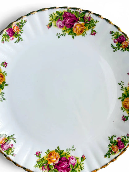 Close-up detail of the vibrant pink, red, and yellow rose transfers and intact 22-carat gold stippling on the scalloped rim of the Royal Albert Old Country Roses cake plate.