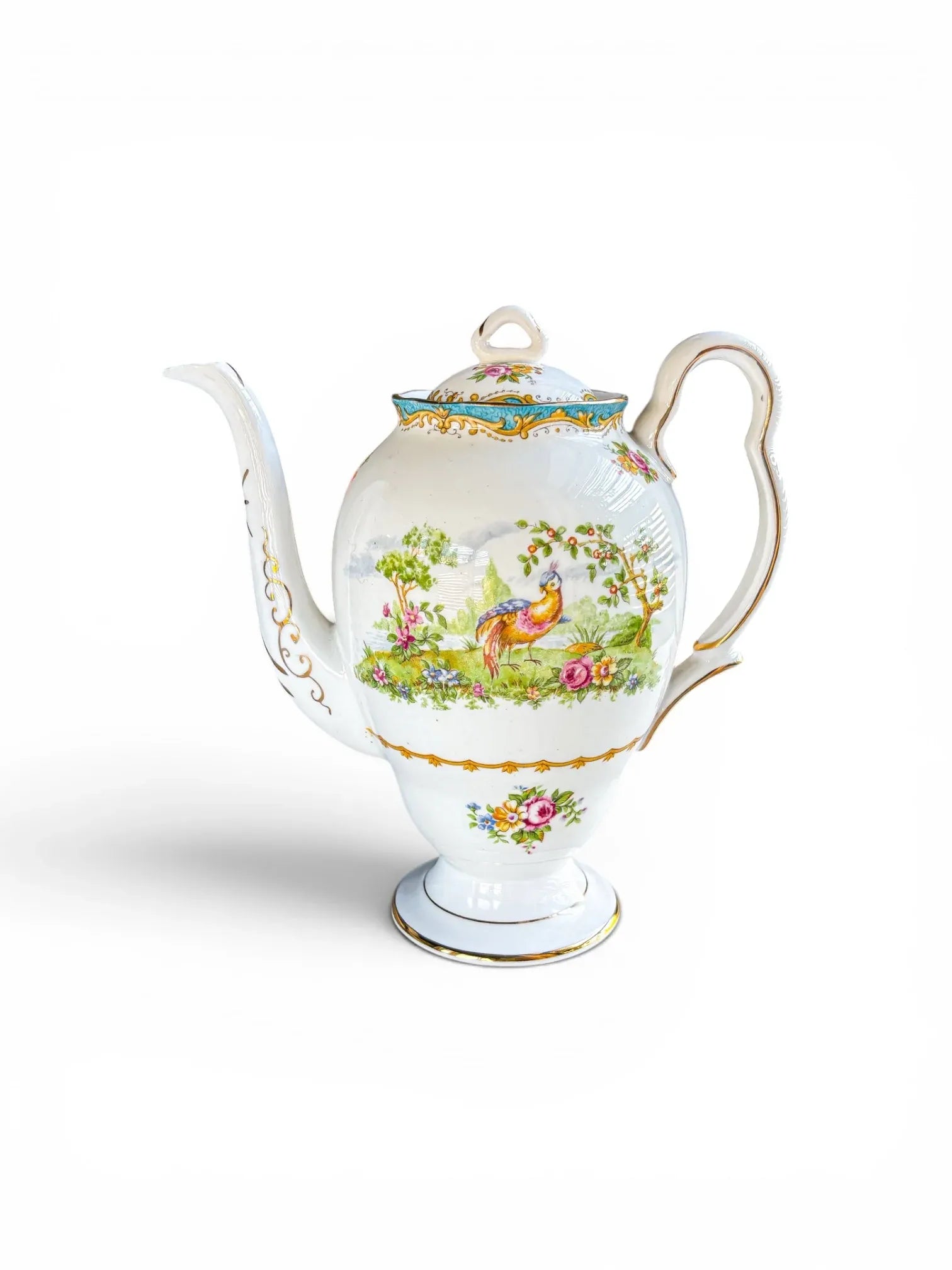 Full profile view of a vintage Royal Albert Chelsea Bird fine bone china coffee pot in the Gainsborough shape against a clean white background. The piece features a vibrant, exotic bird vignette, a flared pedestal foot, an elegant gilded S-scroll handle, and a sweeping spout.