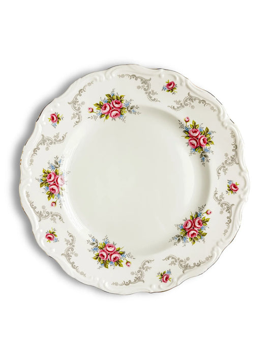 Vintage porcelain plate with pink floral design and ornate silver detailing