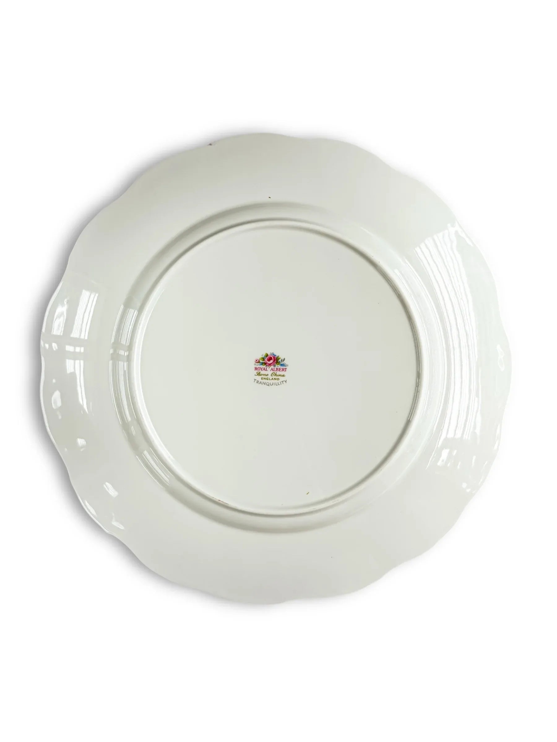 Back of a vintage Royal Albert porcelain plate with floral mark and scalloped edge