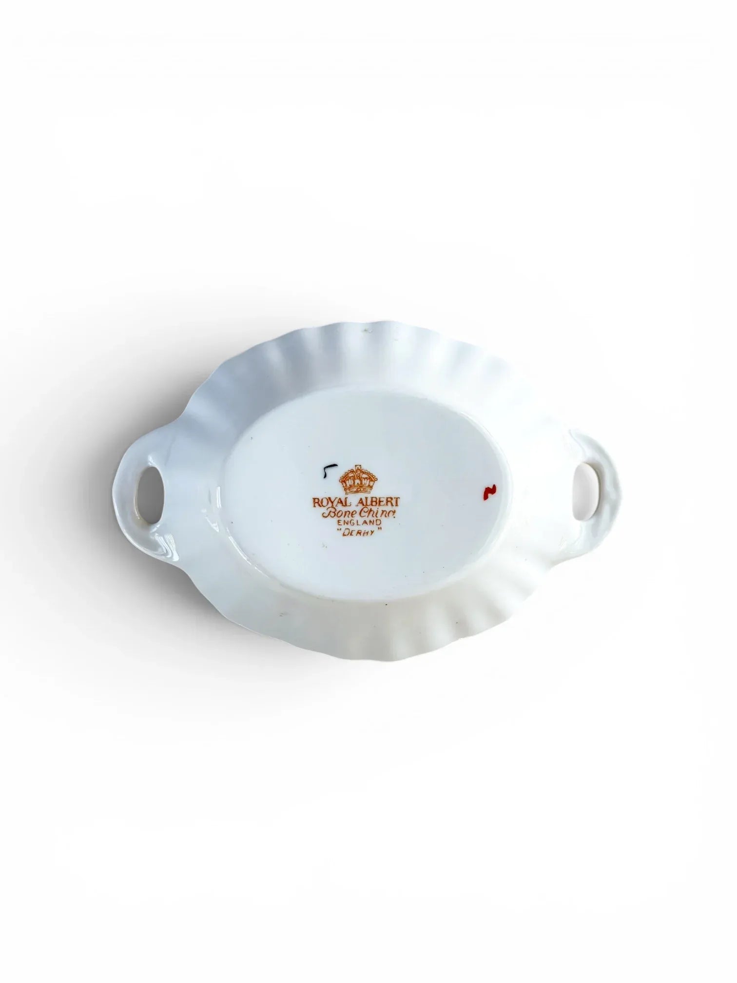 The underside of a vintage Royal Albert bone china dish. The clear backstamp features a golden crown and reads "Royal Albert Bone China England 'Derby'", confirming its mid-century heritage and pattern name.