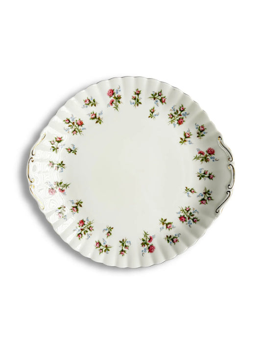 Top-down view of the Royal Albert Winsome handled cake plate featuring pink roses and blue forget-me-not sprays.