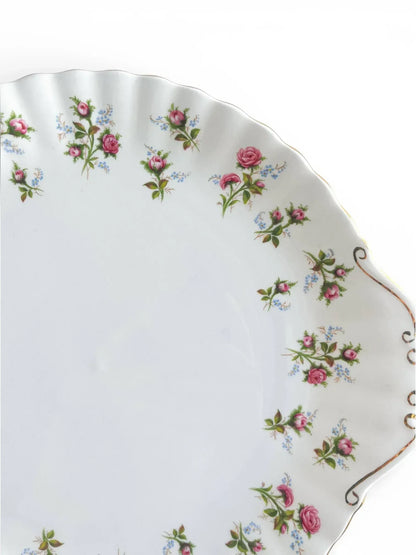 A close-up detail of the Royal Albert Winsome serving plate showcasing the delicate floral pattern, fluted texture, and the hand-applied 22-carat gold scrollwork on the tab handle.