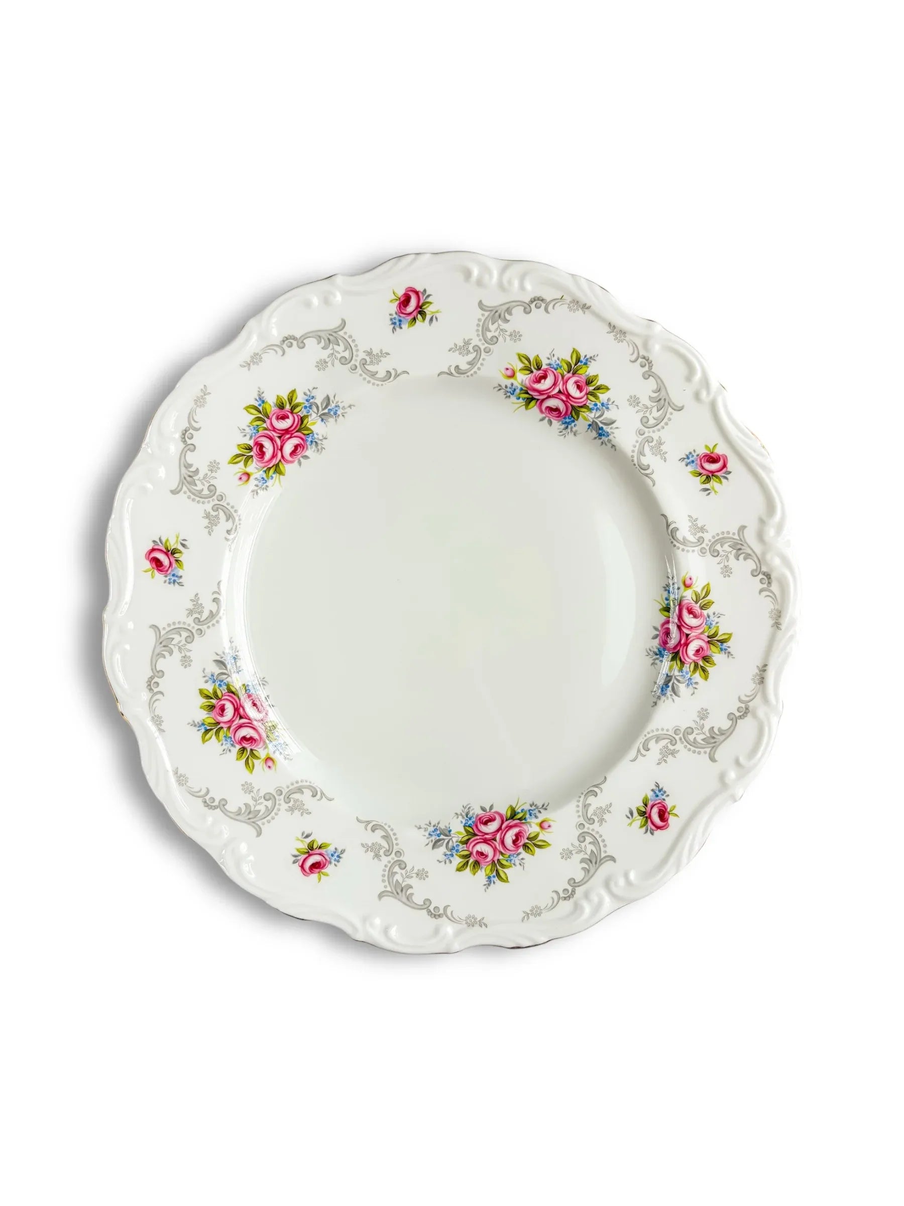 Vintage porcelain plate with pink floral design and ornate silver detailing, collectible tableware