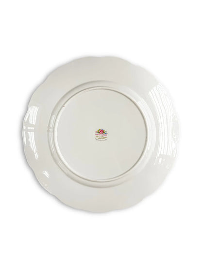 Back of vintage white porcelain plate with floral hallmark, scalloped edge, collectible tableware