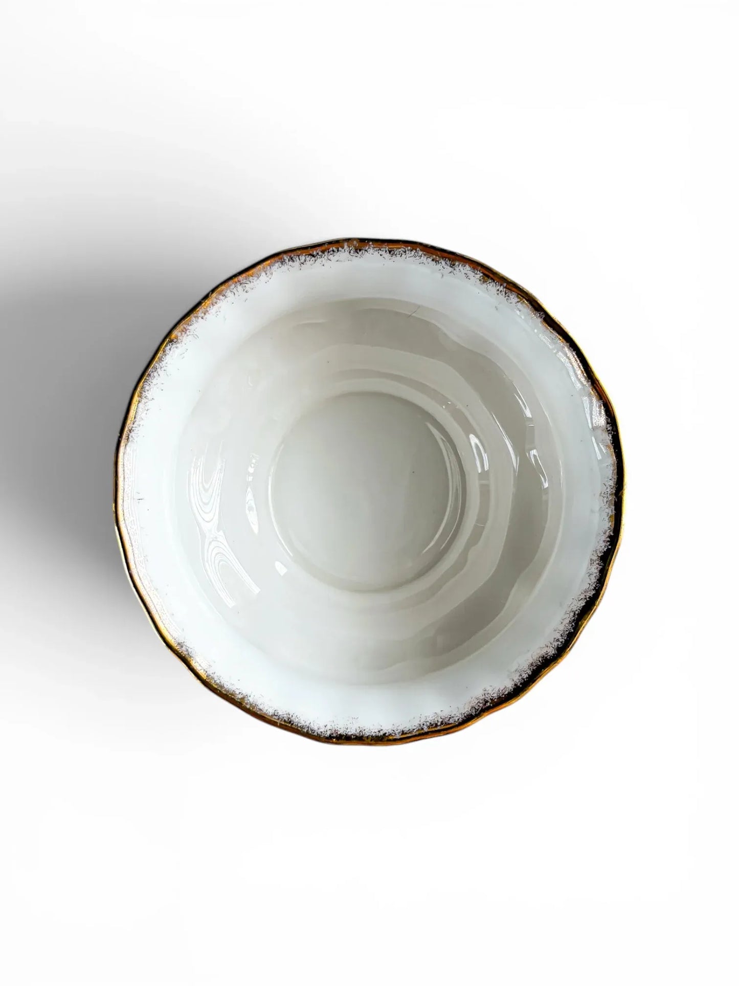 Overhead top-down view looking into the clean, unstained white interior of a Royal Albert Old Country Roses open sugar bowl, showing the round, scalloped 22-carat gold stippled rim.
