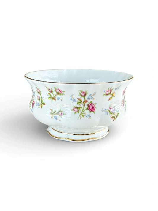 Profile view of a Royal Albert Winsome bone china open sugar bowl on the Montrose shape with pink rose sprays and a gold-trimmed rim.