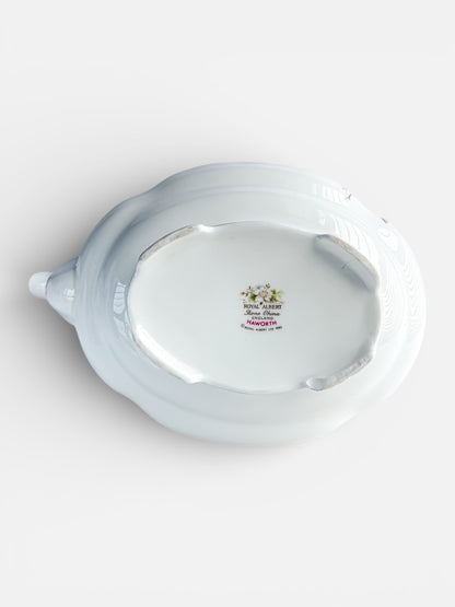 Bottom view of a white Royal Albert Bone China porcelain serving dish with floral logo and 'Haworth' marking