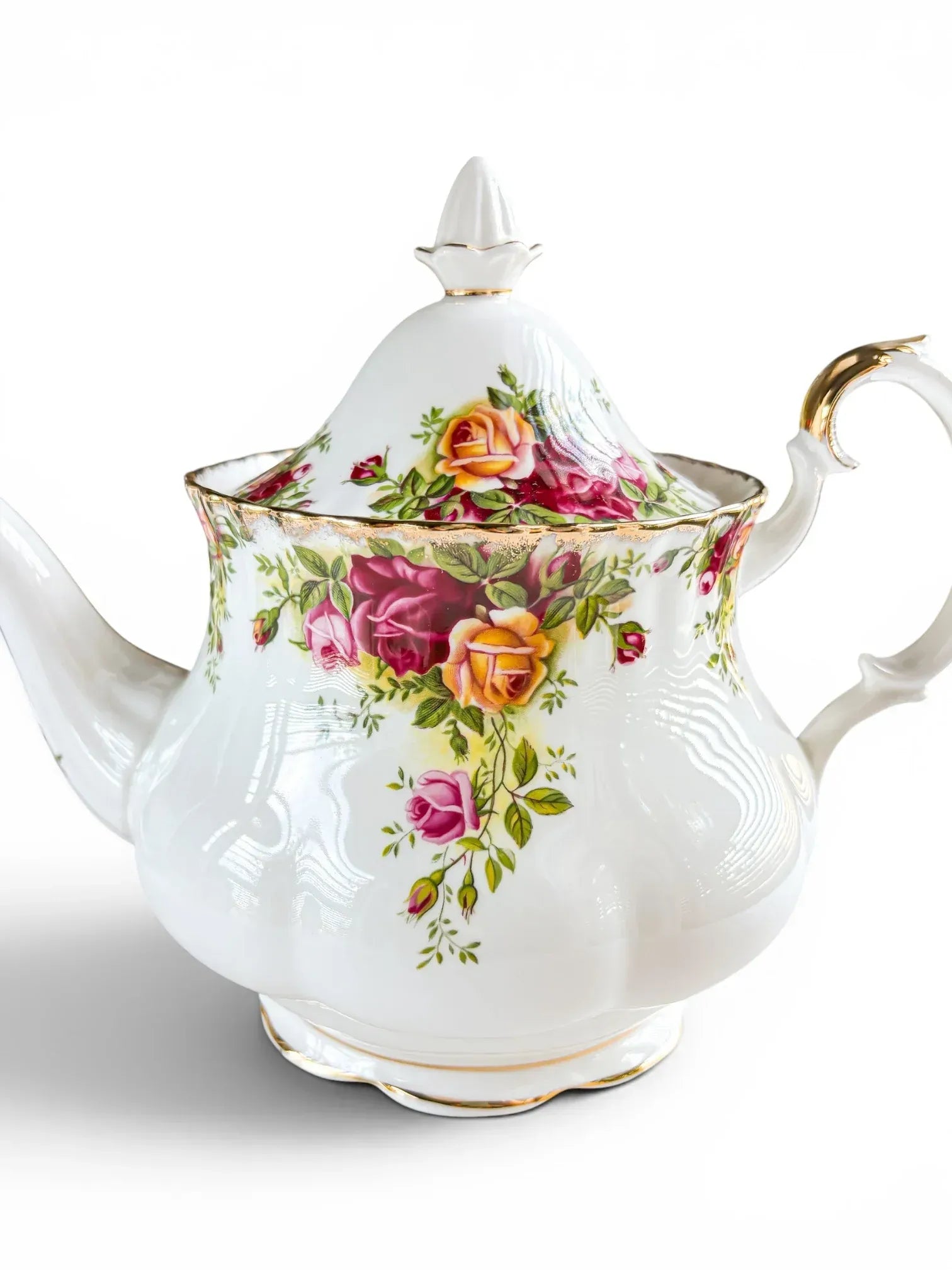 Detailed macro shot of the fluted rim and high-domed lid edge of the Royal Albert Old Country Roses teapot, showing the crisp floral transfers and intact gold sponged edge.