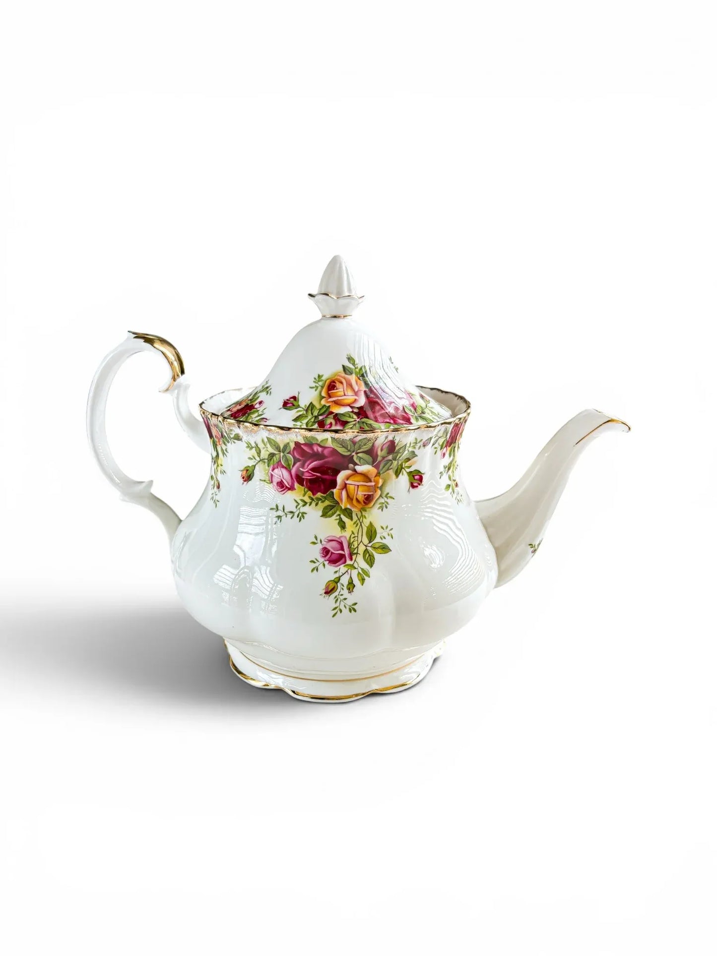 Opposite side profile of the Royal Albert Old Country Roses teapot, showcasing the vibrant red, pink, and yellow cottage rose transfers across the glossy porcelain body.
