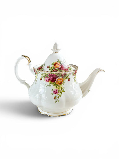 Opposite side profile of the Royal Albert Old Country Roses teapot, showcasing the vibrant red, pink, and yellow cottage rose transfers across the glossy porcelain body.