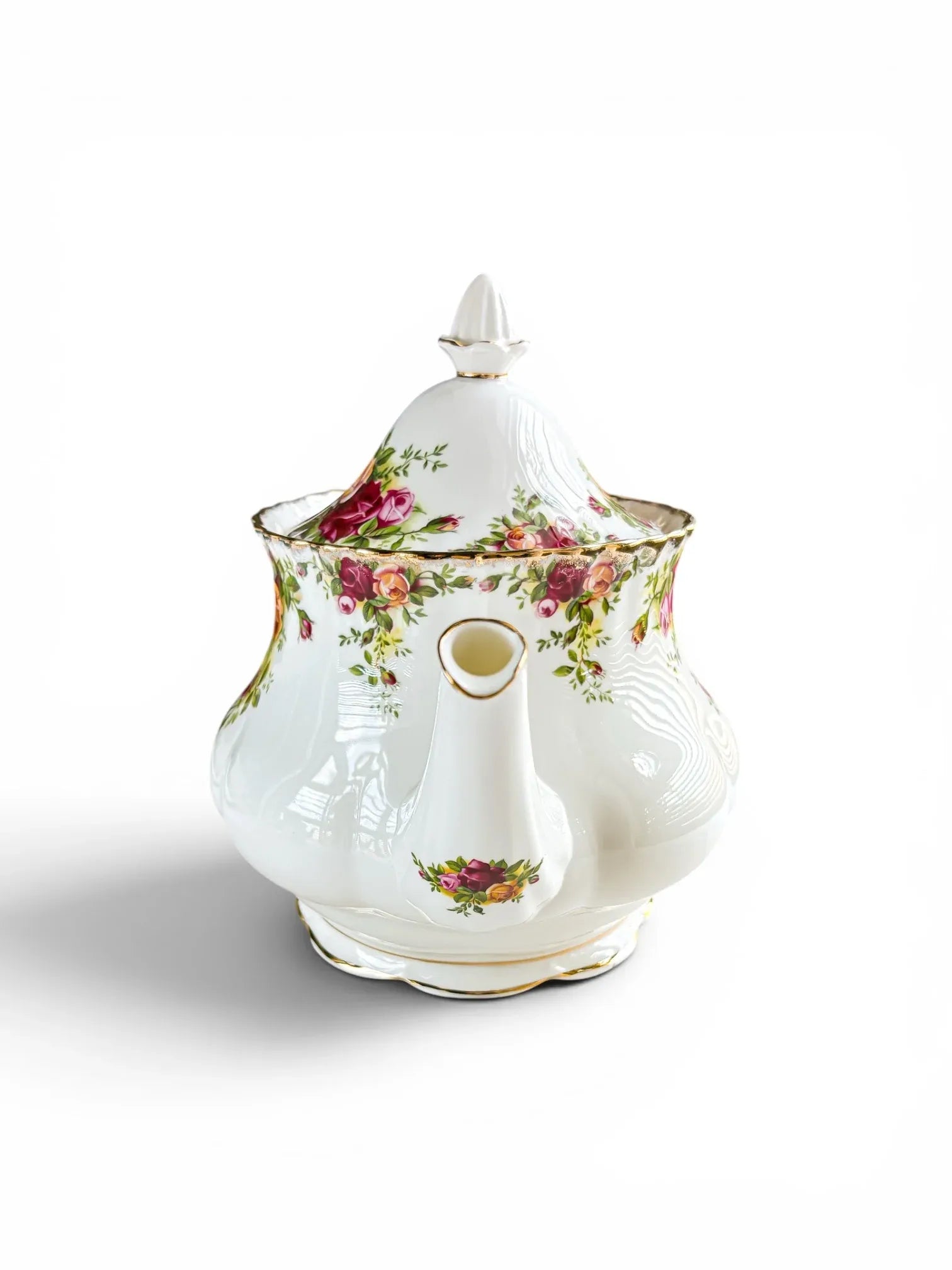 Front view of the Royal Albert Old Country Roses teapot spout, showing the elegant S-curve design and gold stippled borders around the pouring rim on a white background.