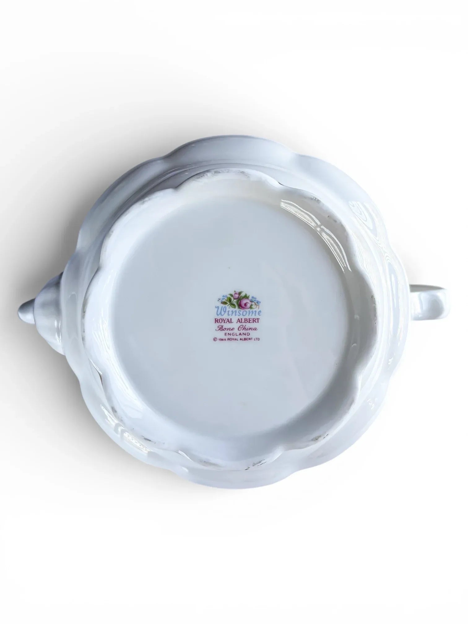 The underside of the teapot showing the original 'Winsome Royal Albert Bone China England' backstamp with 1966 copyright.