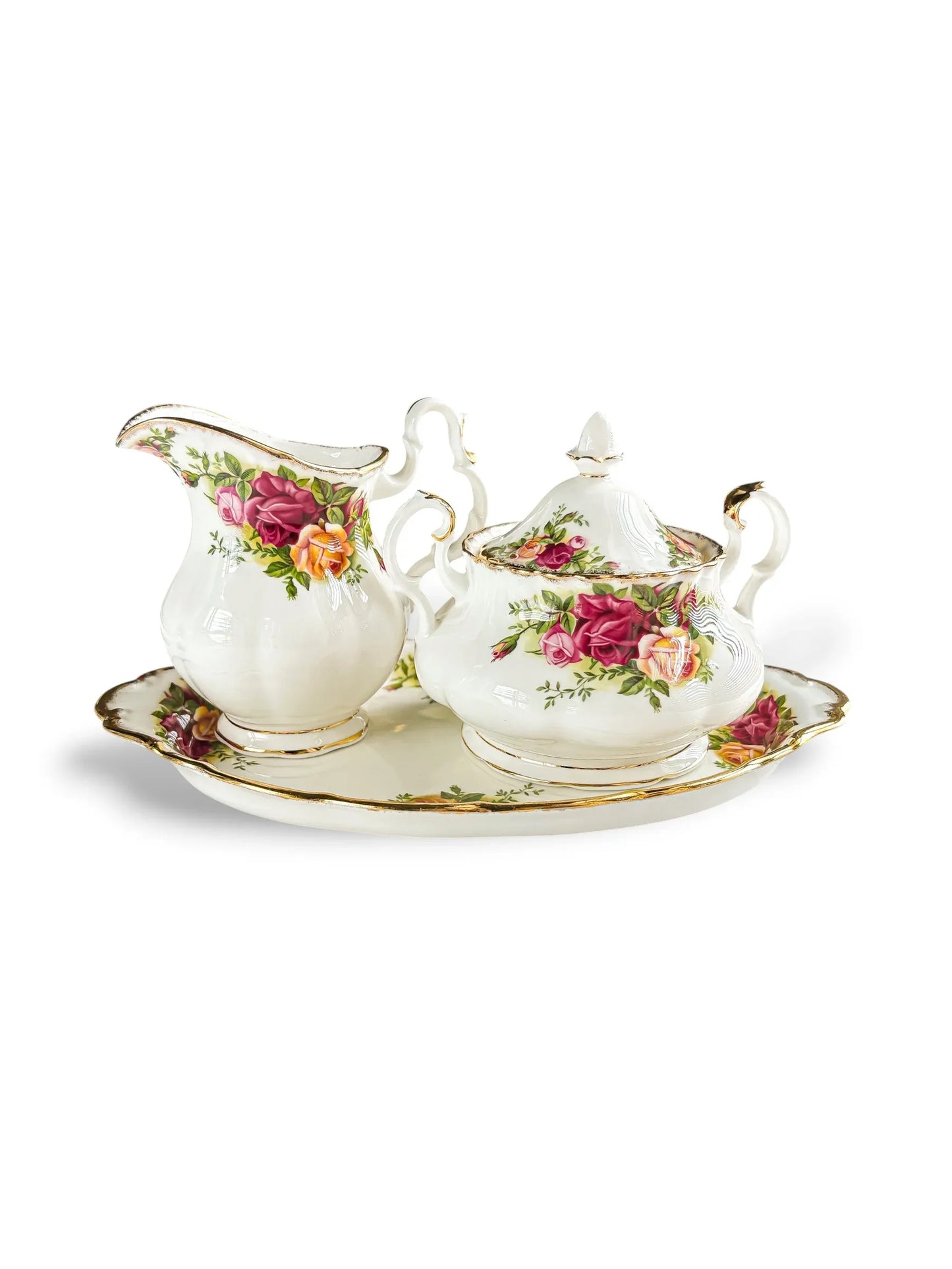 A curated three-piece vintage Royal Albert Old Country Roses tea service set in the Avon shape, including a creamer jug and covered sugar bowl displayed on an oval serving tray.