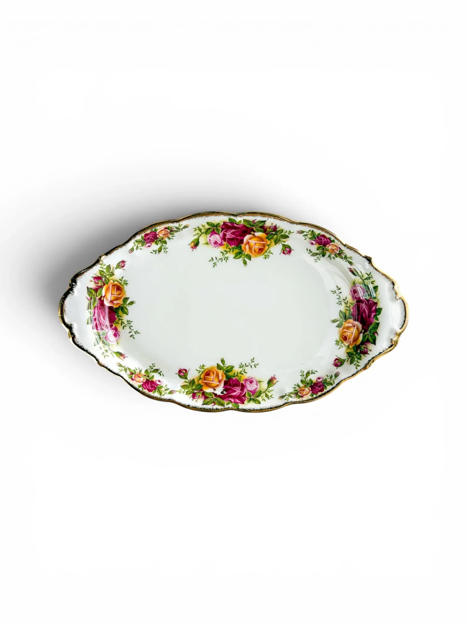 Full top-down view of the oval Royal Albert Old Country Roses serving tray, showcasing the wide porcelain face, scalloped edge, and twin moulded handles.