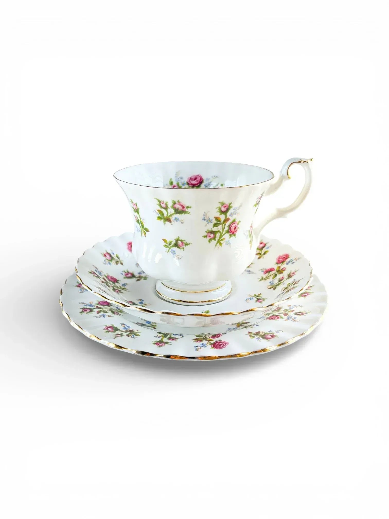 Vintage Royal Albert Winsome bone china trio featuring a teacup, saucer, and side plate with a delicate pink rose and blue forget-me-not pattern on a white fluted Montrose shape.