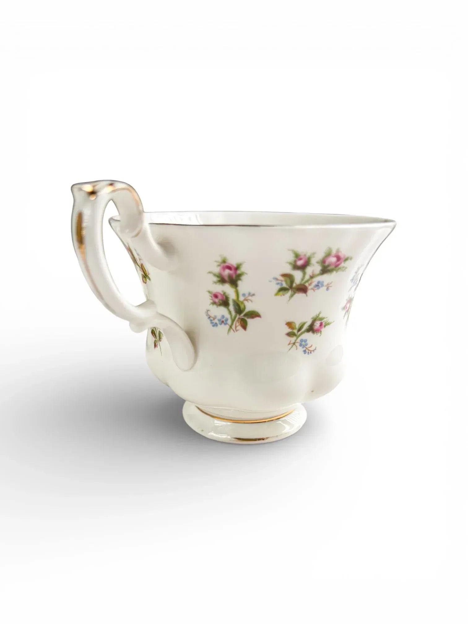 A profile view of the Royal Albert Winsome teacup showing significant rubbing to the gold gilding on the handle and rim.