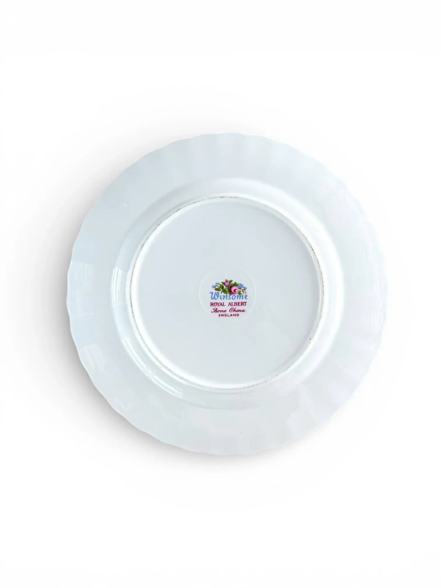 The underside of a Royal Albert Winsome plate showing the authentic "Winsome Royal Albert Bone China England" backstamp with the crown emblem and blue script.