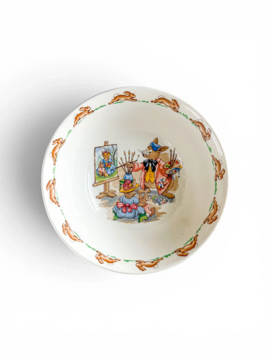 Top-down view of a Royal Doulton Bunnykins Portrait Painter cereal bowl.