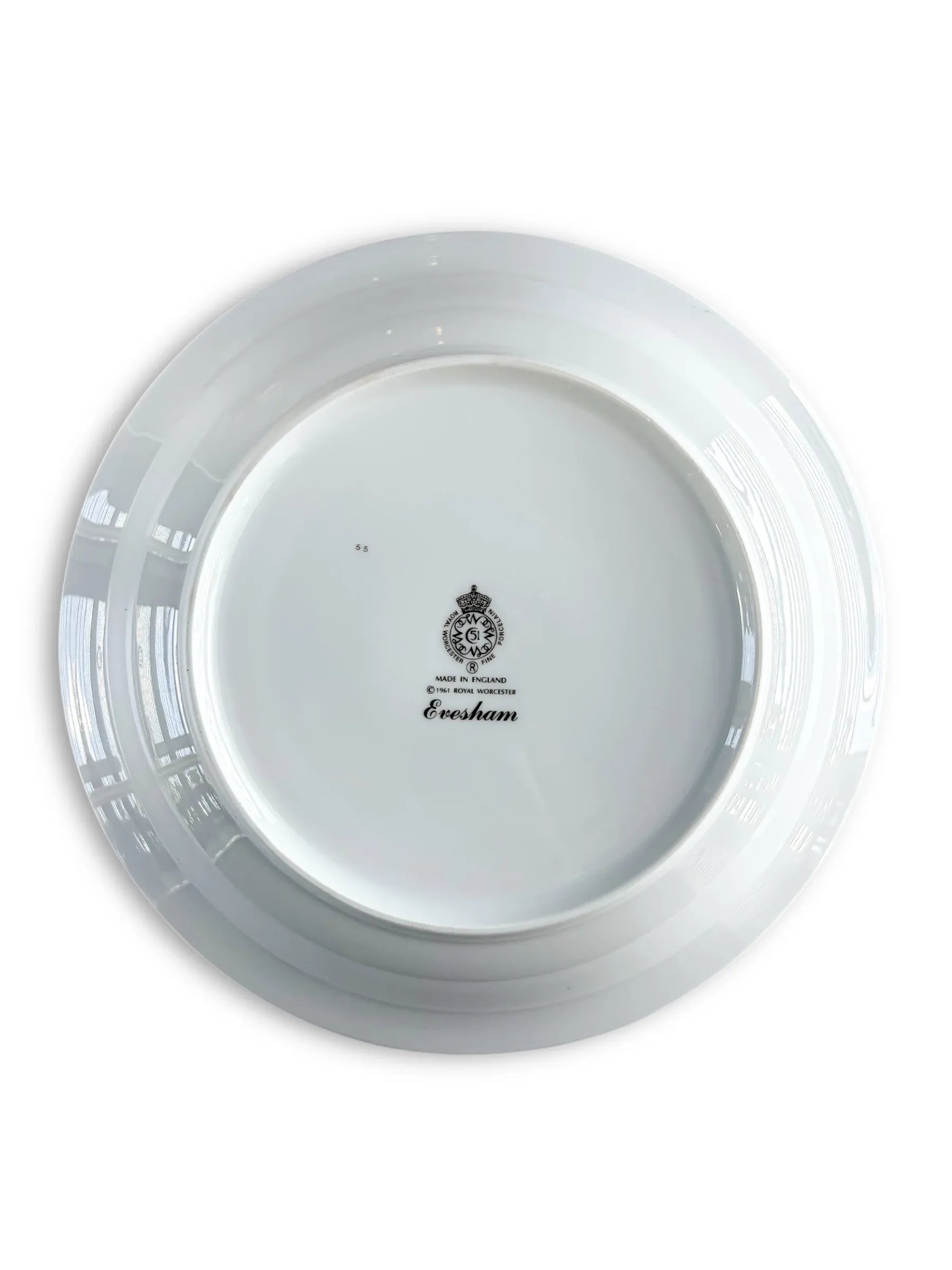 The underside of a Royal Worcester Evesham bowl showing the black crown backstamp, 'Made in England', and the 1961 copyright mark.