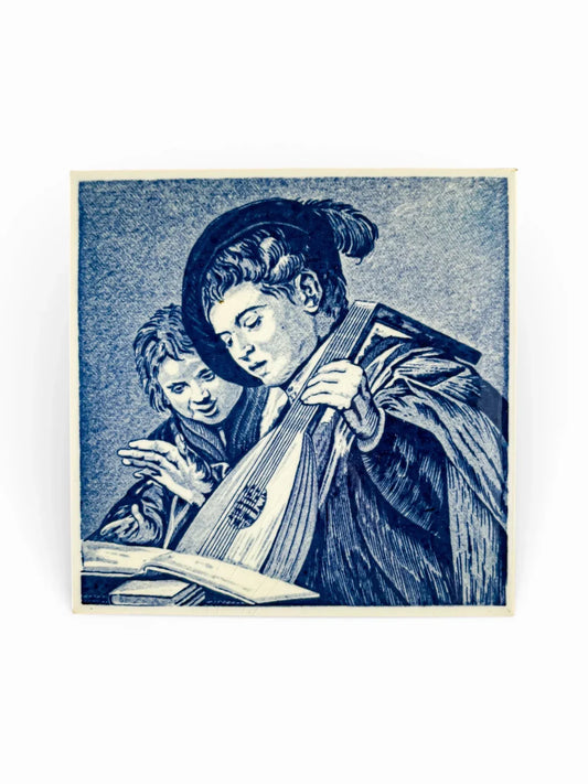 Vintage Delft blue tile featuring Frans Hals Singing Lads painting.