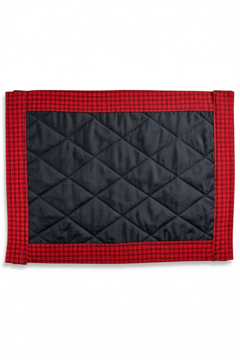 Black quilted fabric placemat with red plaid border