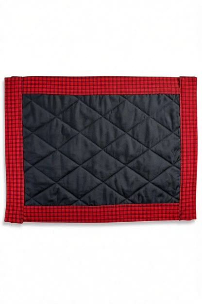 Black quilted fabric placemat with red plaid border