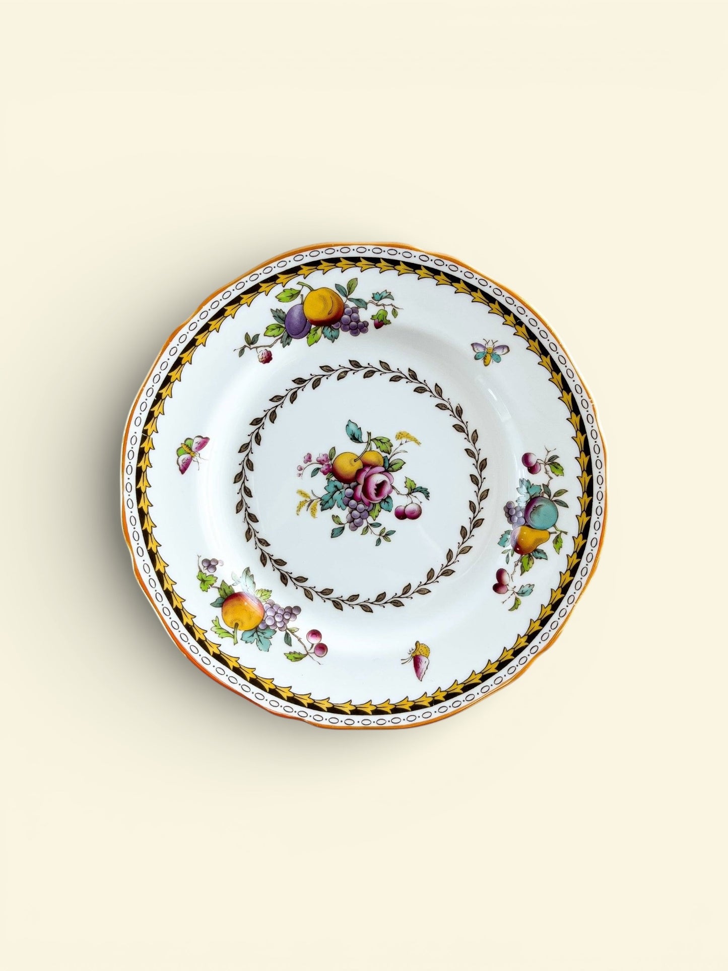 Vintage Spode Rockingham porcelain bread and butter plate with fruit and floral design, yellow border