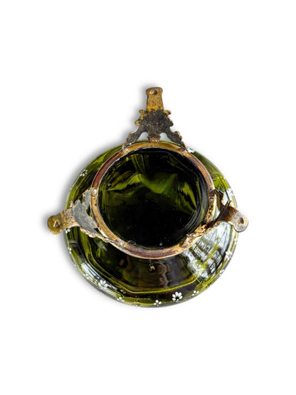 Top view of vintage green glass bowl with metal handles and floral accents