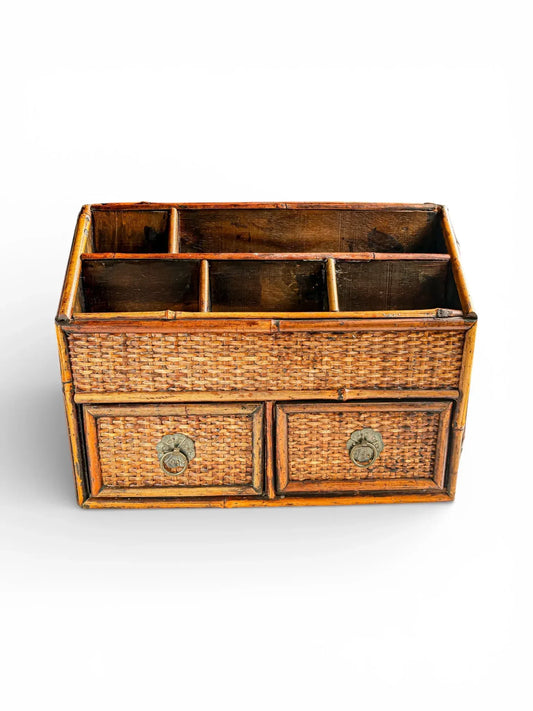 Vintage bamboo organizer with woven drawers and brass handles, ideal for tableware storage.
