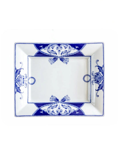 Vista Alegre Villa rectangular porcelain serving dish in cobalt blue and white, overhead view, rope tassels and corner scrolls on a white background.