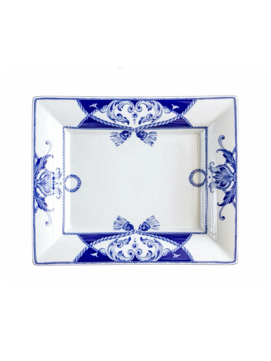 Vista Alegre Villa rectangular porcelain serving dish in cobalt blue and white, overhead view, rope tassels and corner scrolls on a white background.