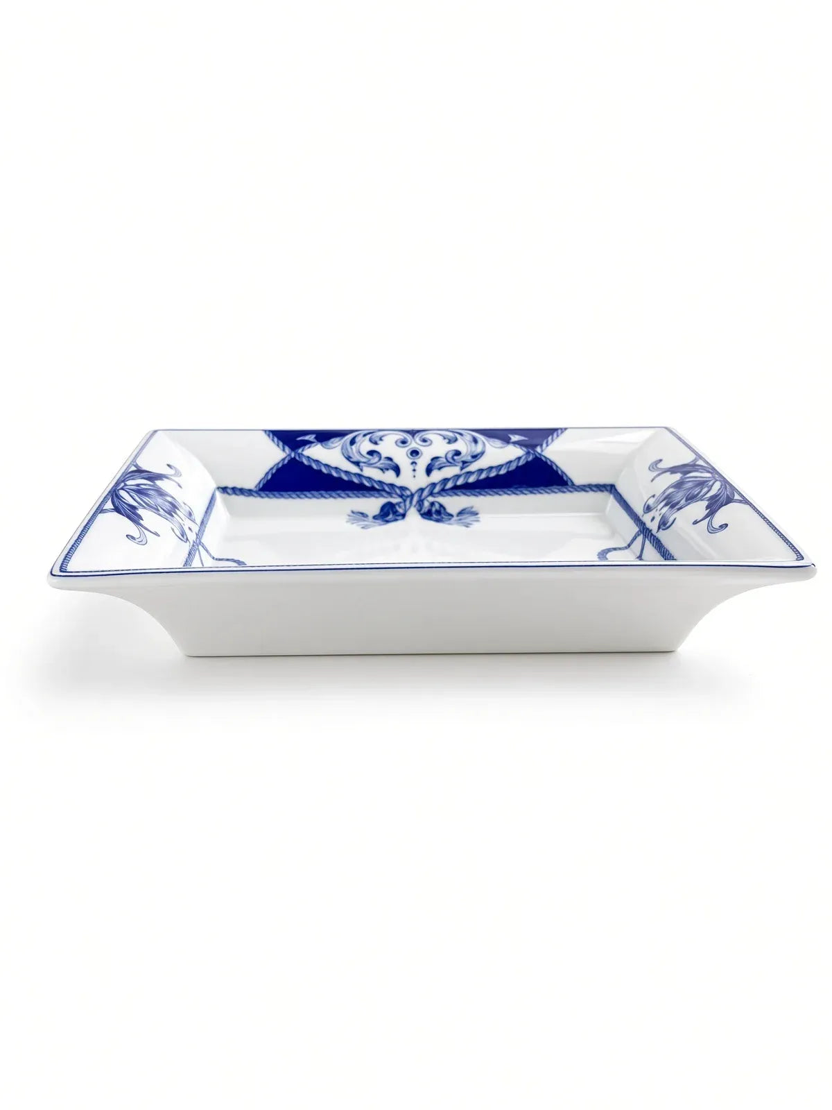 Vista Alegre Villa porcelain dish in side profile, showing the flared white sides, shallow well and cobalt rope border.