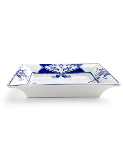Vista Alegre Villa porcelain dish in side profile, showing the flared white sides, shallow well and cobalt rope border.