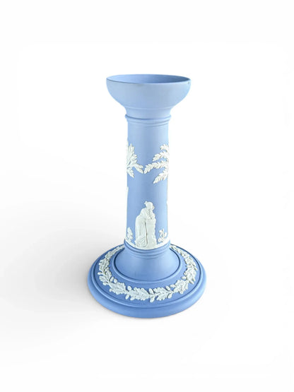 Blue porcelain candlestick with white neoclassical relief, vintage tableware on white background