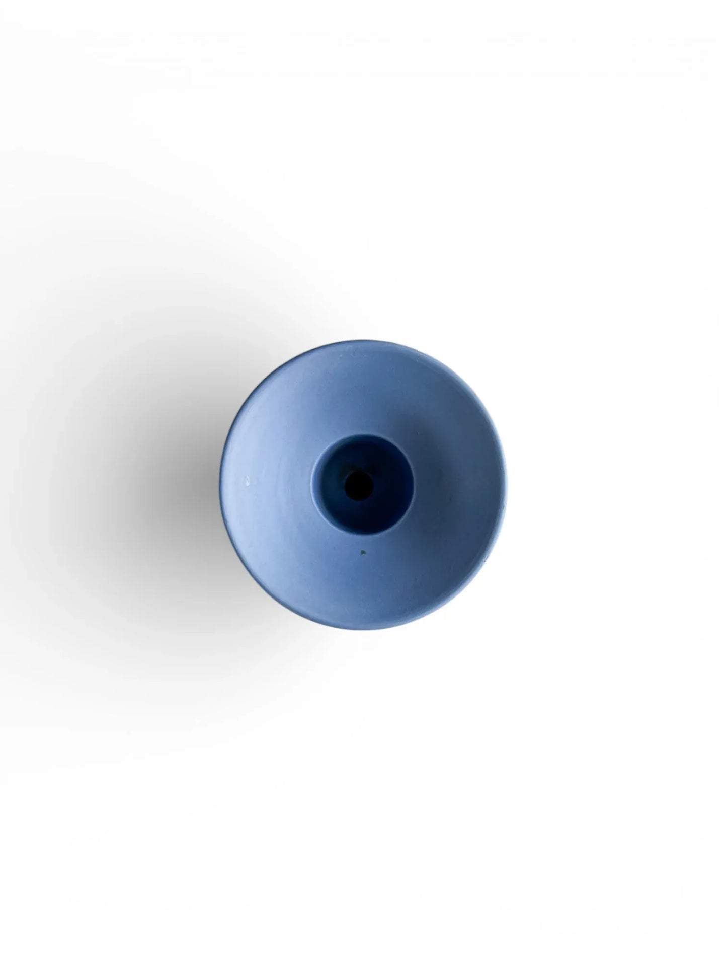 Minimalist blue porcelain vase on white background, modern tableware decor