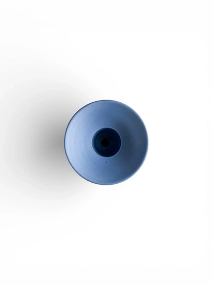 Minimalist blue porcelain vase on white background, modern tableware decor