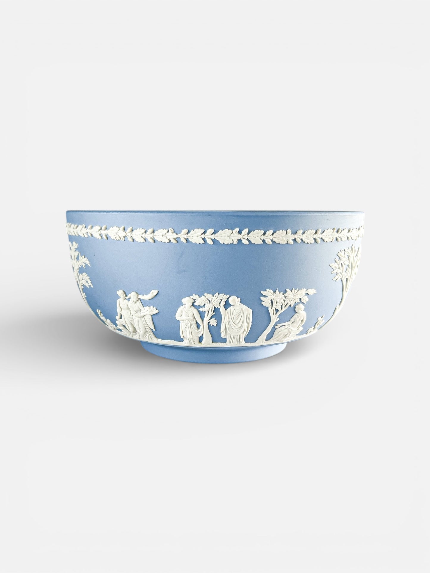 Blue Wedgwood jasperware bowl with white classical relief figures and leaf border