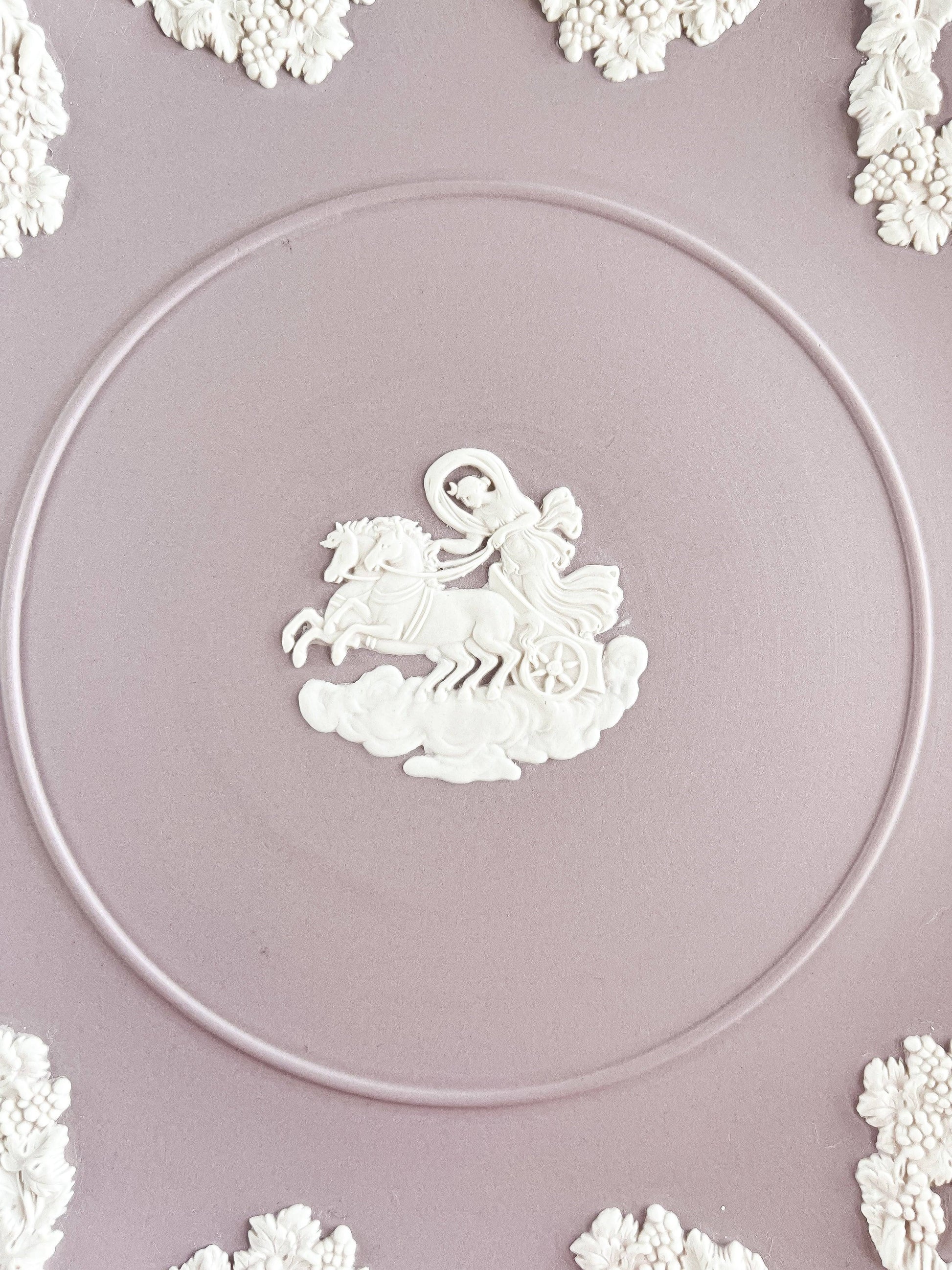Lilac Wedgwood Jasperware plate with white relief Aurora chariot design and floral border